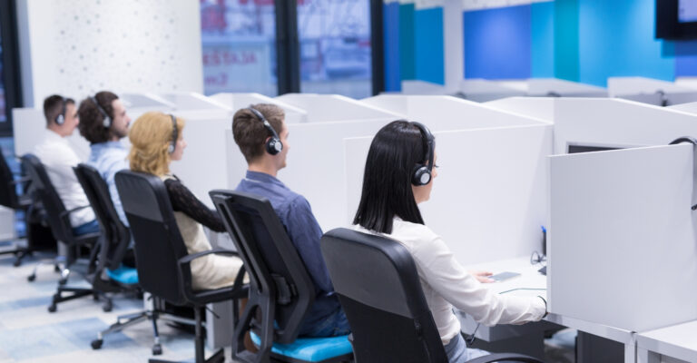 An office with employees working in headset